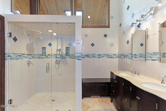 26 Lark Ct Unit B, Eagle-Vail, CO 81620 - full bath with double vanity, a shower stall, tile patterned flooring, and tile walls