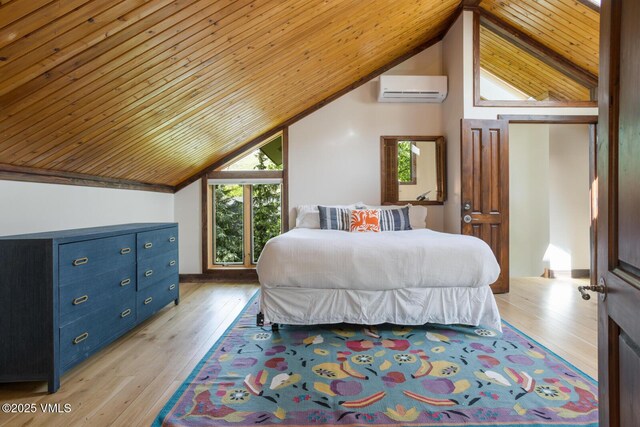 26 Lark Ct Unit B, Eagle-Vail, CO 81620 - bedroom featuring a wall mounted AC, vaulted ceiling, wood ceiling, and light wood-style floors