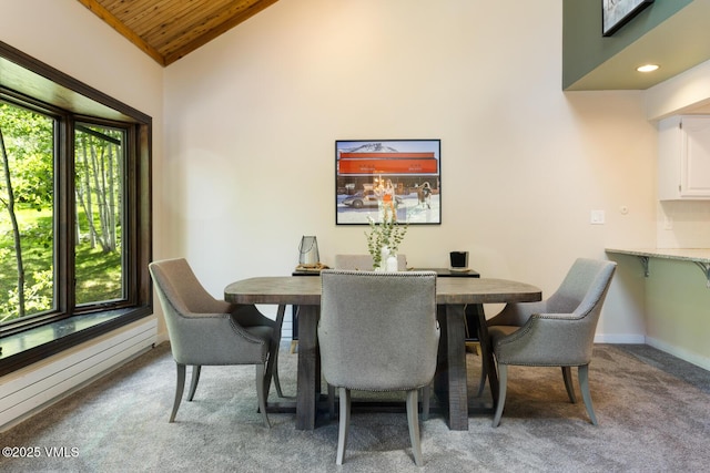 26 Lark Ct Unit B, Eagle-Vail, CO 81620 - dining room with wood ceiling, light colored carpet, baseboards, a baseboard radiator, and high vaulted ceiling