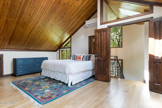26 Lark Ct Unit B, Eagle-Vail, CO 81620 - bedroom with lofted ceiling, a wall unit AC, wood finished floors, and wood ceiling