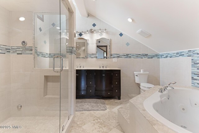 26 Lark Ct Unit B, Eagle-Vail, CO 81620 - bathroom featuring vaulted ceiling, a jetted tub, a stall shower, vanity, and toilet