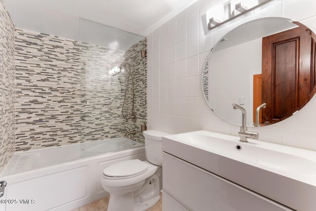 26 Lark Ct Unit B, Eagle-Vail, CO 81620 - full bathroom featuring tile walls, vanity, toilet, and bathtub / shower combination