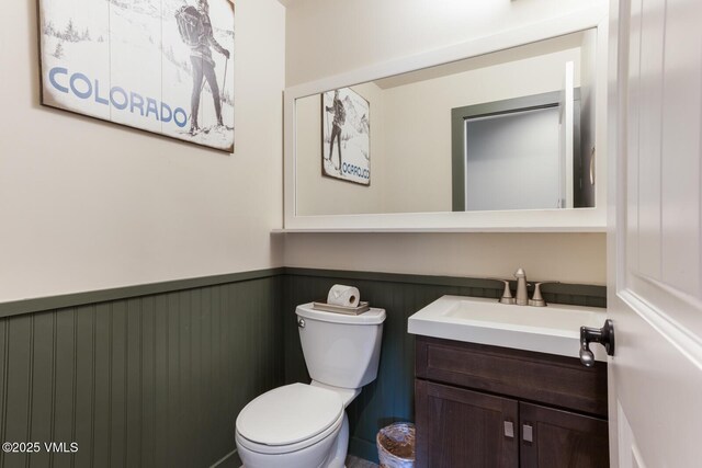 26 Lark Ct Unit B, Eagle-Vail, CO 81620 - bathroom with a wainscoted wall, vanity, and toilet