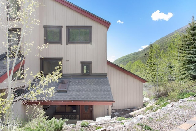 view of side of property with a mountain view