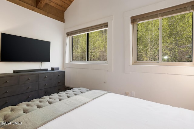 bedroom featuring wood ceiling and lofted ceiling