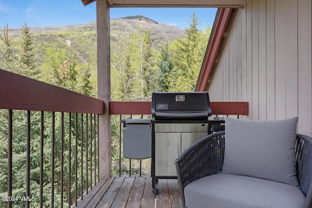 wooden terrace featuring a mountain view