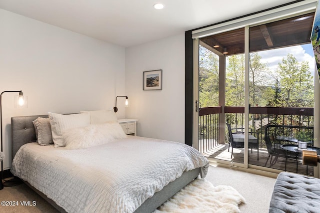 bedroom featuring floor to ceiling windows, carpet, and access to outside