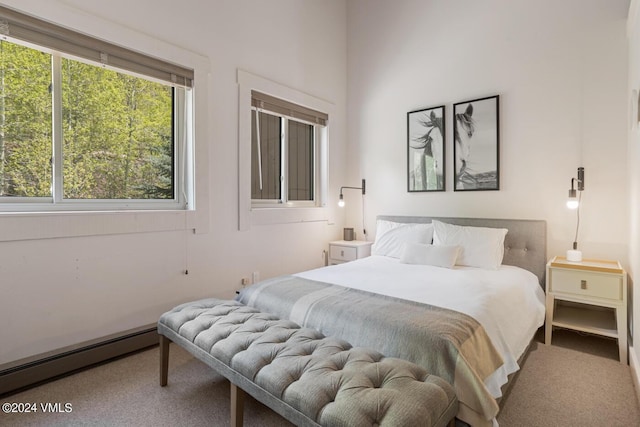 bedroom featuring a baseboard heating unit