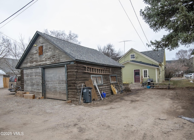 425 Broadway St, Eagle, CO 81631 - exterior space featuring an outbuilding, driveway, a garage, and log siding