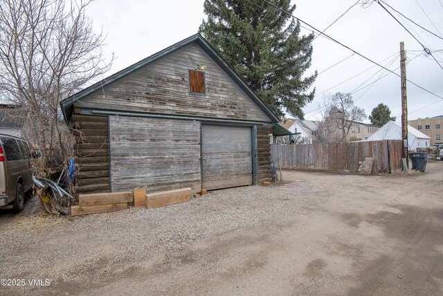 425 Broadway St, Eagle, CO 81631 - detached garage featuring gravel driveway and fence