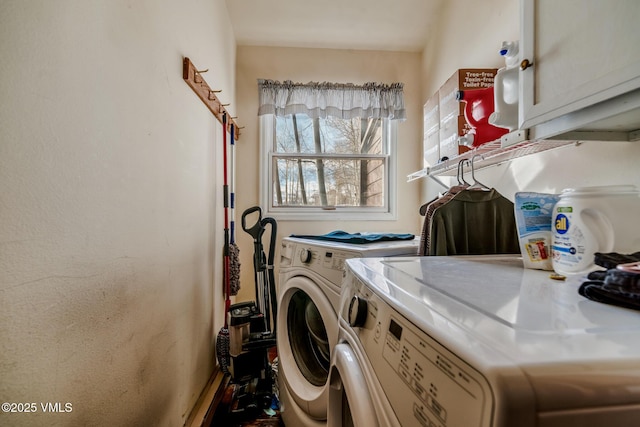 clothes washing area with cabinet space and washing machine and clothes dryer