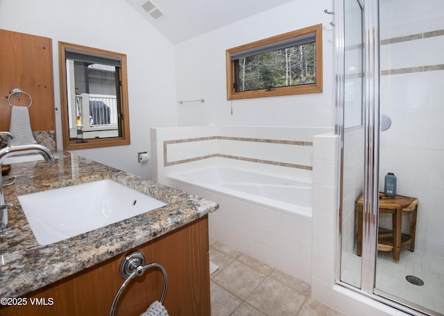 1460 Buffehr Creek Rd Unit C, Vail, CO 81657 - full bath with lofted ceiling, a shower stall, a garden tub, vanity, and tile patterned floors
