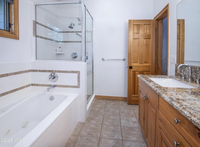 1460 Buffehr Creek Rd Unit C, Vail, CO 81657 - full bath featuring a bath, a shower stall, vanity, tile patterned floors, and baseboards