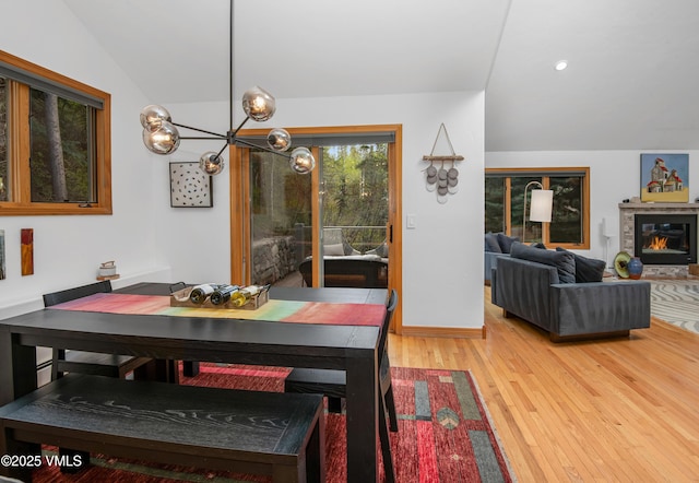 1460 Buffehr Creek Rd Unit C, Vail, CO 81657 - dining space with light wood-style flooring and a chandelier