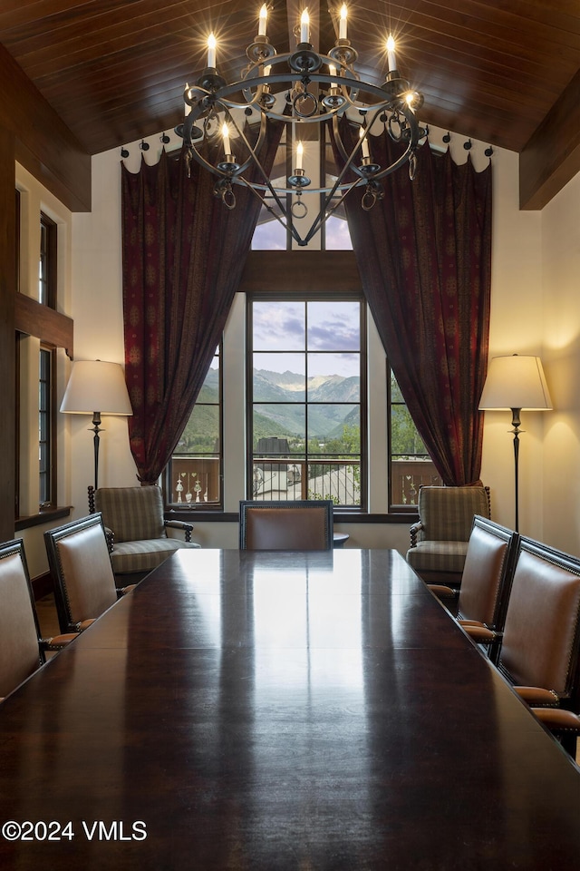 unfurnished dining area featuring a mountain view, wood ceiling, vaulted ceiling, and a notable chandelier