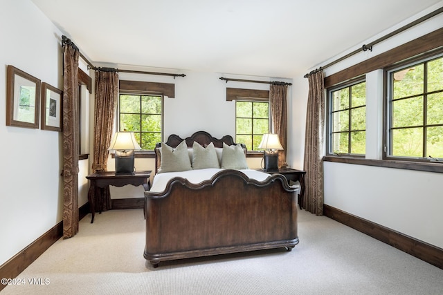 bedroom featuring light colored carpet