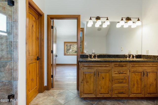 416 Eby Creek Rd, Eagle, CO 81631 - full bathroom featuring double vanity and baseboards