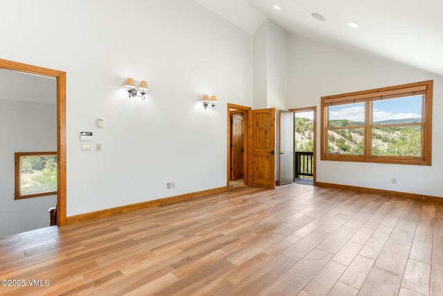 416 Eby Creek Rd, Eagle, CO 81631 - unfurnished living room featuring high vaulted ceiling, light wood finished floors, and recessed lighting