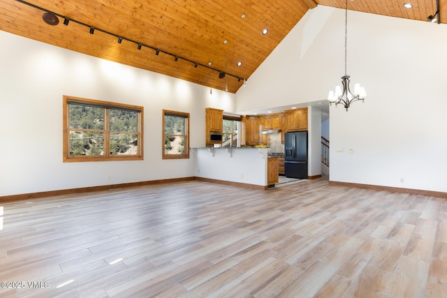 416 Eby Creek Rd, Eagle, CO 81631 - unfurnished living room featuring a chandelier, high vaulted ceiling, wooden ceiling, rail lighting, and light wood-type flooring