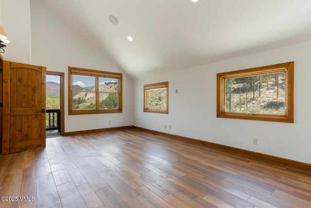 416 Eby Creek Rd, Eagle, CO 81631 - empty room with plenty of natural light, wood finished floors, a high ceiling, and recessed lighting