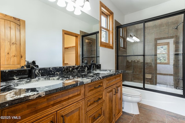 416 Eby Creek Rd, Eagle, CO 81631 - bathroom featuring double vanity and shower / bath combination with glass door
