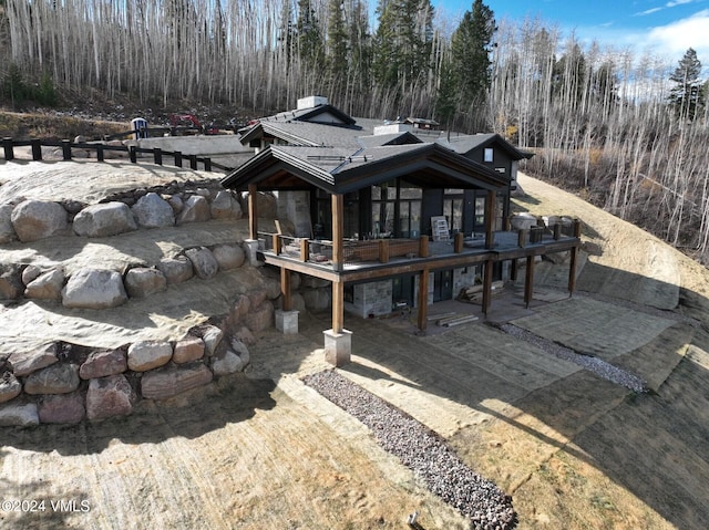 rear view of property featuring a patio area