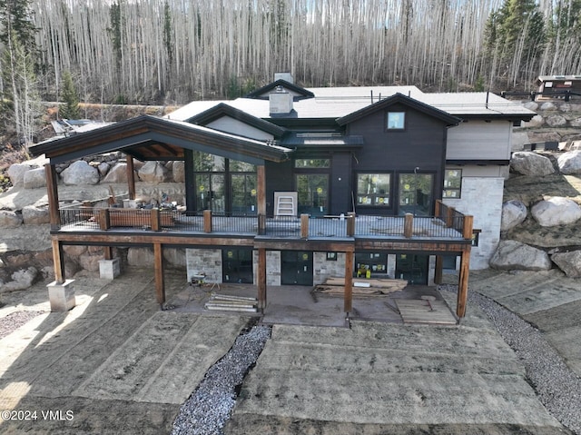 exterior space featuring a deck and a patio