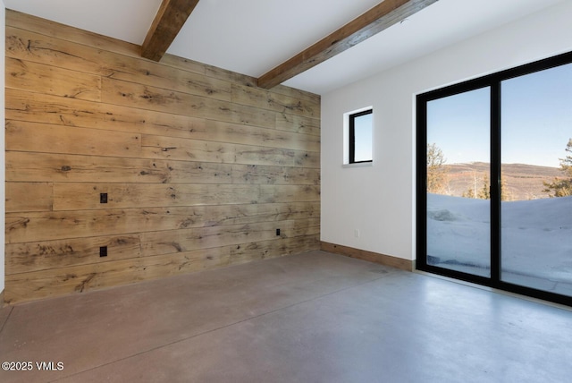 181 Black Bear Trl, Edwards, CO 81632 - unfurnished room with concrete floors, wood walls, beamed ceiling, and baseboards