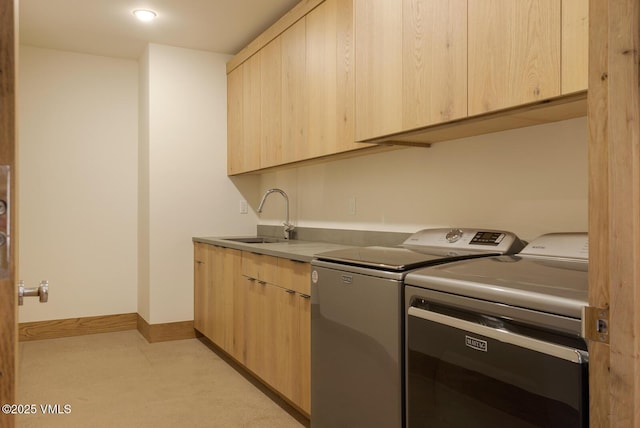 181 Black Bear Trl, Edwards, CO 81632 - washroom with washing machine and dryer, baseboards, a sink, and cabinet space