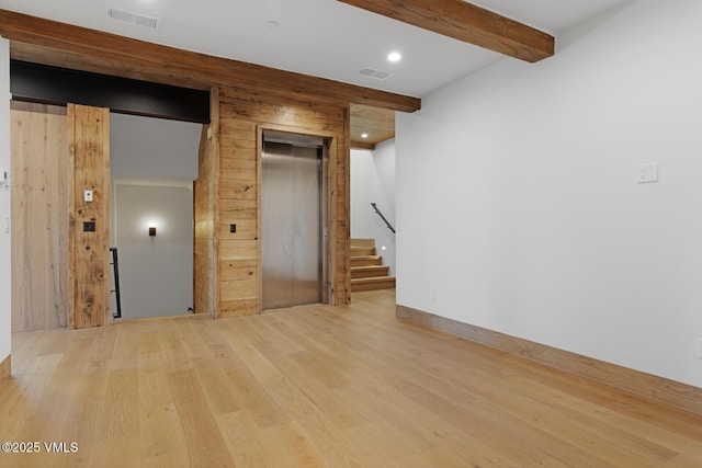 181 Black Bear Trl, Edwards, CO 81632 - basement featuring elevator, recessed lighting, stairs, visible vents, and wood finished floors