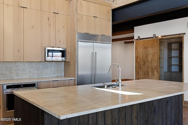 181 Black Bear Trl, Edwards, CO 81632 - kitchen featuring light brown cabinetry, modern cabinets, and stainless steel appliances