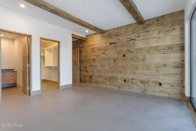 181 Black Bear Trl, Edwards, CO 81632 - unfurnished room featuring finished concrete floors, recessed lighting, wood walls, baseboards, and beam ceiling