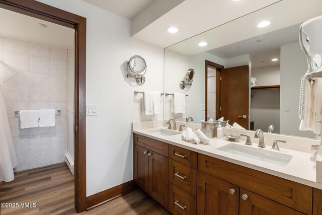 120 Offerson Rd Unit 3460, Beaver Creek, CO 81620 - full bath with wood finished floors, double vanity, baseboards, recessed lighting, and baseboard heating