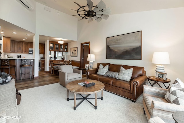 120 Offerson Rd Unit 3460, Beaver Creek, CO 81620 - living area with a ceiling fan, wood finished floors, a wall mounted AC, and recessed lighting