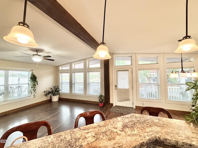 66 Bluegill Loop, Gypsum, CO 81637 - dining area with dark wood-type flooring, a ceiling fan, beam ceiling, and baseboards