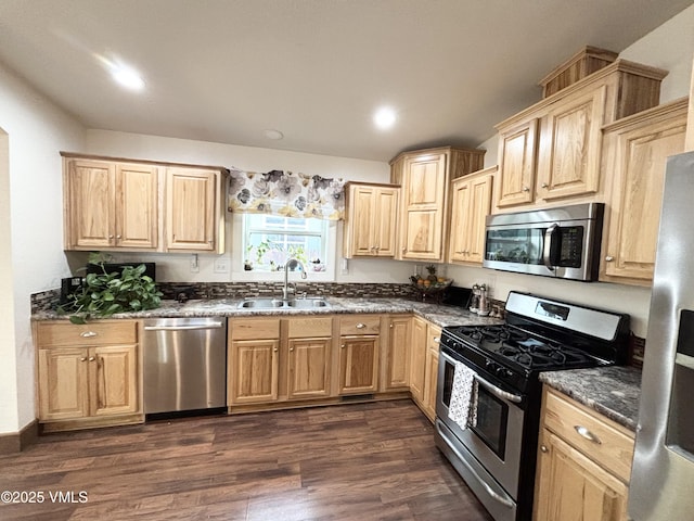 66 Bluegill Loop, Gypsum, CO 81637 - kitchen with stainless steel appliances, a sink, light brown cabinetry, dark wood-type flooring, and recessed lighting