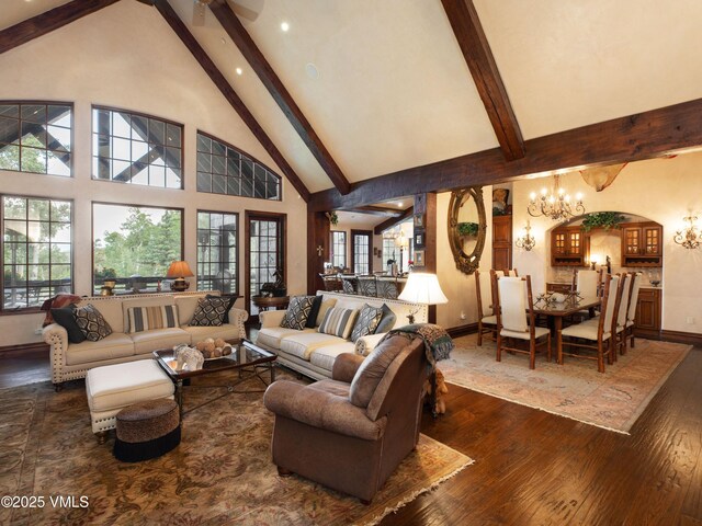 140 Elk Woods Rd, Edwards, CO 81632 - living area with beamed ceiling, hardwood / wood-style flooring, high vaulted ceiling, a chandelier, and arched walkways