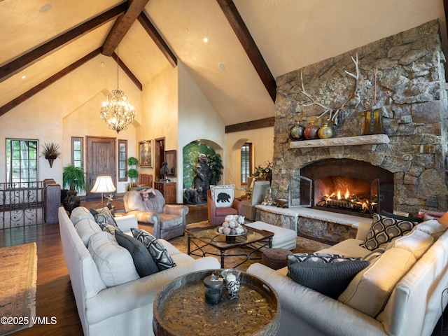 140 Elk Woods Rd, Edwards, CO 81632 - living room with high vaulted ceiling, beam ceiling, wood finished floors, a chandelier, and a stone fireplace
