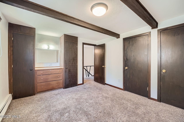 unfurnished bedroom with multiple closets, beam ceiling, light carpet, baseboards, and baseboard heating
