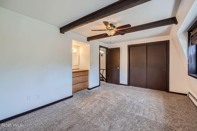 unfurnished bedroom with ceiling fan, carpet floors, baseboards, beamed ceiling, and a closet