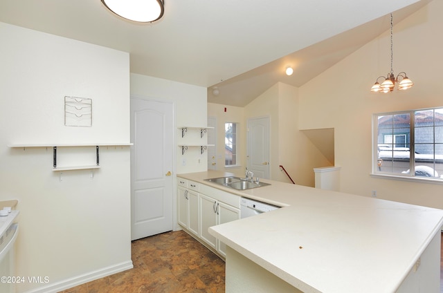 kitchen with a sink, a peninsula, light countertops, dishwasher, and vaulted ceiling