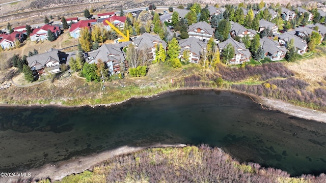 birds eye view of property featuring a residential view and a water view