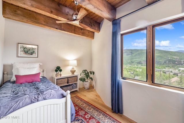767 Charolais Cir, Edwards, CO 81632 - bedroom with light wood-style flooring and a wooden ceiling with exposed beams