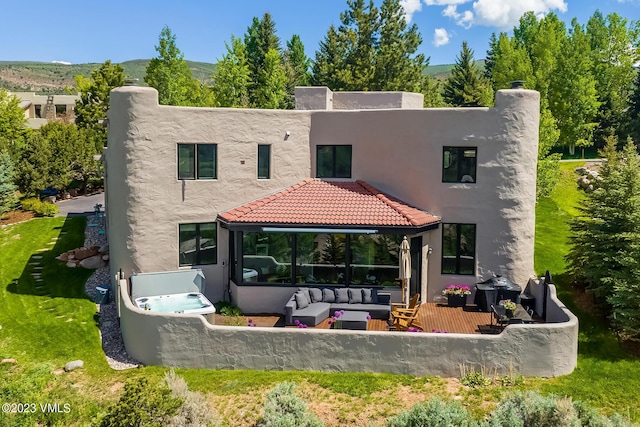 767 Charolais Cir, Edwards, CO 81632 - rear view of property with outdoor lounge area, a patio, and stucco siding