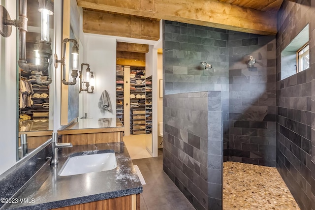 767 Charolais Cir, Edwards, CO 81632 - bathroom with vanity, a spacious closet, a walk in shower, and concrete floors