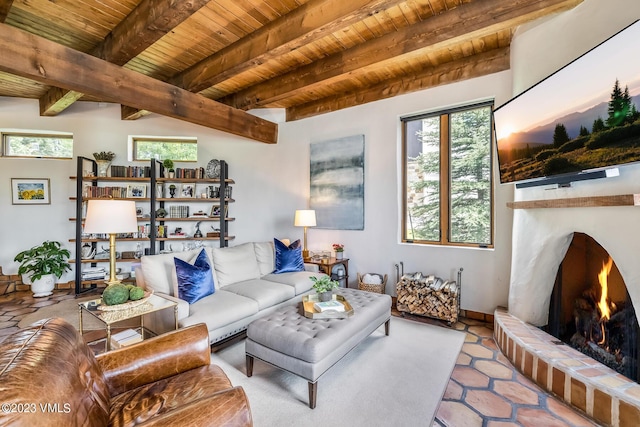 767 Charolais Cir, Edwards, CO 81632 - tiled living room featuring a wooden ceiling with exposed beams and a fireplace