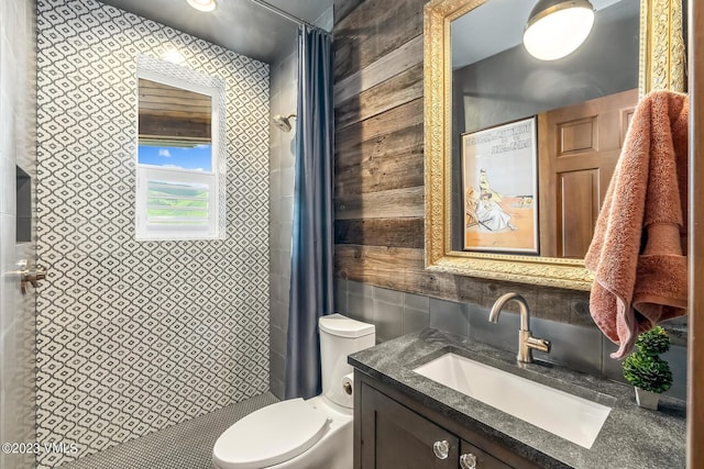 767 Charolais Cir, Edwards, CO 81632 - bathroom with tile walls, a stall shower, and vanity