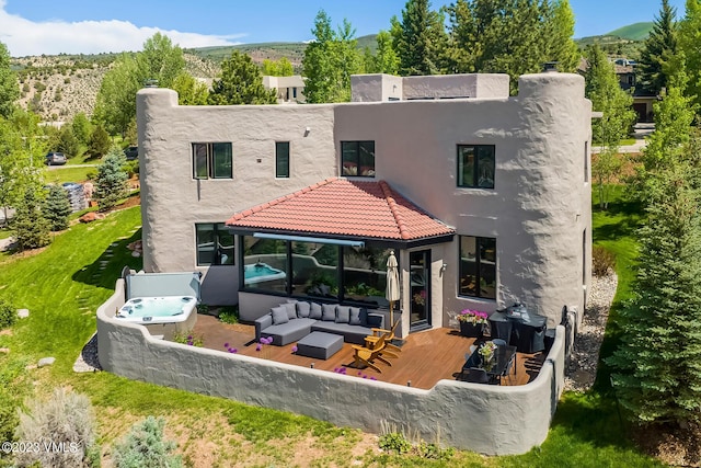 767 Charolais Cir, Edwards, CO 81632 - back of house featuring stucco siding, a deck with mountain view, and an outdoor living space