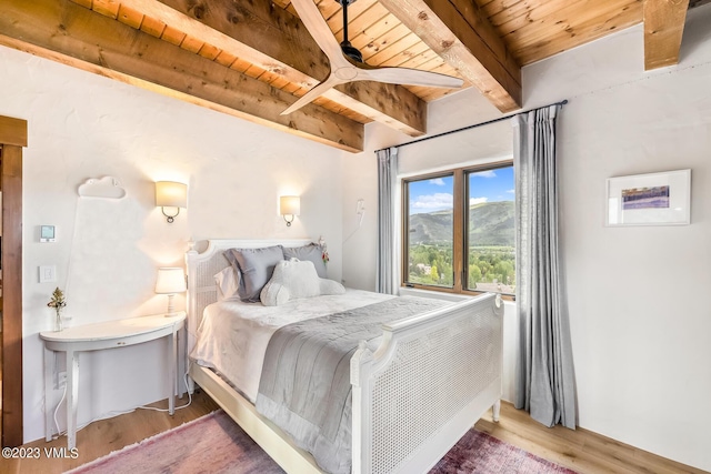 767 Charolais Cir, Edwards, CO 81632 - bedroom with a wooden ceiling with exposed beams, wood finished floors, and a mountain view