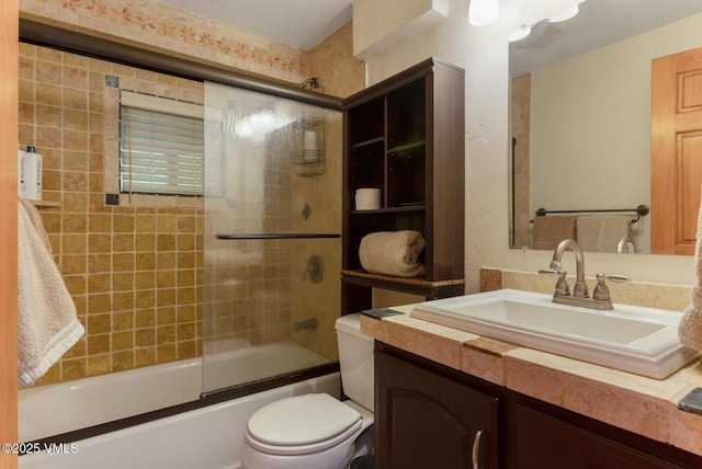 2821 Basingdale Blvd Unit 4, Vail, CO 81657 - full bathroom with vanity, toilet, and shower / bath combination with glass door